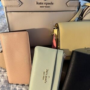 Two brand new purses. Two barely used purses and 4 wallets.